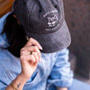 Zwarte denim pet - Logo "Anti-Social Cat Owner" 